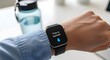 © Becheer - Smartwatch screen displaying Time to Hydrate notification reminder on wrist with water bottle background