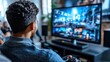 © imagineRbc - A man is watching television in a living room. The television is on a large screen and is displaying a video game. The man is sitting on a couch and he is enjoying the game
