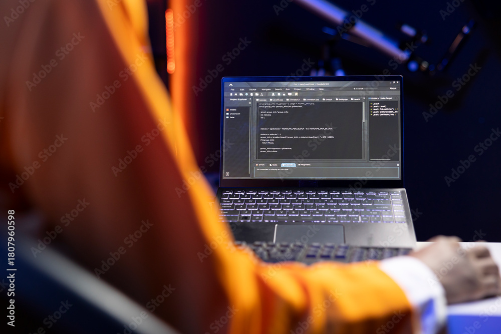 Person in home office looking at UI on laptop screen, typing and ...