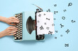 © Pixel-Shot - Woman typing on typewriter with blank paper sheet on blue background