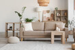 © Pixel-Shot - Interior of stylish living room with cozy grey sofa, coffee table and houseplants
