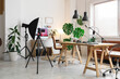 © Pixel-Shot - Interior of podcaster's studio with tables, sofa and plants