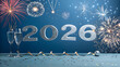 © MAHABUBHOSSEN - Sparkling 2026 new year celebration with champagne glasses and colorful fireworks against a festive blue backdrop, symbolizing joy and anticipation