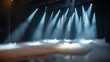 © Golam - Beams of bright stage lights illuminate the performance platform filled with white fog