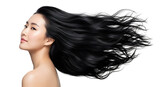 Gorgeous Asian woman with long luxurious black hair dramatically flowing showcasing incredible health shine and strength in a captivating studio portrait highlighting stunning dark tresses