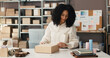© DavidsPrime/peopleimages.com - Woman, packing and logistics with box for small business distribution, online order or packaging. Female person, entrepreneur or preparation with parcel for courier service, shipping or safe delivery