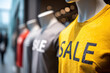 © Emanuel - Mannequins wearing Sale T-Shirts in a shop window