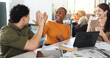 © DavidsPrime/peopleimages.com - Excited, creative team or laptop with high five in meeting for KPI stats, brand performance or goals. Digital marketing, graphs and people with celebration at agency for campaign approval and results