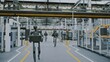 © Framestock - Humanoid Robots Working Automation and AI in Modern Futuristic Factory. Android Robots Moving Equipment in Clean, Automated Industrial Environments. Concept of Future of Work and AI Driven Automation.