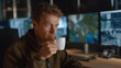 © forenna - A night-shift intelligence officer analyzing infrared drone feeds in a low-light room filled with screens, marking suspicious patterns while sipping cold coffee — covert surveillance, critical