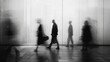© Bi - Blurred figures moving through a modern space
