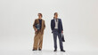 © Lustre Art Group  - Two stylish male professionals posing confidently in modern tailored office outfits. Concept of business identity, fashion editorial aesthetics, and contemporary leadership image.