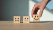 © JH45 - Hand selecting a positive emotion wooden block from a sequence of sentiment options