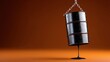 © OleksandrZastrozhnov - Oil barrel leaking crude on orange background with chain suspension