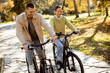 © BGStock72 - Couple enjoys a sunny autumn day biking together in the park