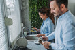 © Miljan Živković - Couple washing dishes together during daily routine