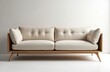 © Maryna - Minimalist studio shot displays modern couch. Beige sofa tufted cushions, wood frame. Furniture stylish, comfortable. Home interior design with luxury furniture. Living room with simple aesthetic.