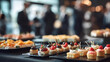 © sornram - An elegant array of gourmet pastries and appetizers at a modern event, showcasing vibrant colors and exquisite presentation.