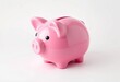 © Pimchada - A charming pink piggy bank, shiny and new, sits on a white background, security, pink piggy bank