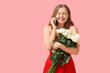 © Pixel-Shot - Happy young woman with bouquet of white roses talking by phone on pink background