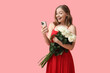 © Pixel-Shot - Beautiful young woman with bouquet of white roses and mobile phone on pink background