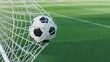 © mir nahid - A soccer ball caught in the net against a blurred green background on a sunny day game