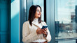 © FlexOn/peopleimages.com - Phone, text message and thinking with business woman in glass office for financial feedback. App, finance and typing with thoughtful employee in corporate workplace for planning or risk management