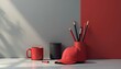 © Vadym - Minimalist composition of office items against a red and grey background. Red mug cap pens pencils and pencil holder are arranged. Modern product branding design concept in neutral colors.