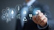 © OngCaLucK - Businessperson Interacting with Digital Icons Representing Renewable Energy, Sustainability, and Environmental Technology Concept in Modern Office Setting