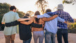 © Lomb - Group of friends smiling outdoors wearing sunglasses and casual shirts