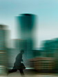 © Westend61 - Man running in city with motion blur conveying hurry and speed