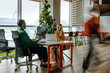 © Westend61 - Businessman and businesswoman having discussion at modern office desk