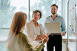 © Westend61 - Colleagues discussing strategy at office board during meeting