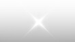 © Dipak Stocks - Bright White Four Point Star Lens Flare Light Effect with Clear Rays on a Transparent Background