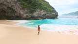 Rear View Nude Woman On Secluded Tropical Beach With Turquoise Surf