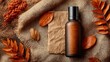 © Cdel - Elegant skincare product display, amber bottle on textured surface with natural elements, earthy tones, inviting atmosphere.