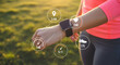 © Pixel Studio - Woman checks fitness tracker smartwatch during outdoor workout monitoring heart rate distance pace and steps for health and wellness using wearable technology for data analysis