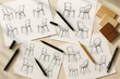 © Miltan - Creative furniture design sketches showing variations of modern chair concepts drawn on paper with pencils and markers