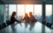 © cui - Blurred background of a modern office interior with blurred business people working in a team at a table. High quality