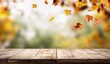 © walker - Wide-angle autumn scene with rustic wooden table and colorful leaves, sunlit background perfect for lifestyle blog posts, seasonal promotions, or creative social media banners.