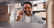 © DavidsPrime/peopleimages.com - Smile, man and phone call for logistics in warehouse for inspection, contact supplier and schedule. Male person, boxes and mobile for discussion, quality assurance and order inquiry for distribution