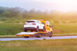 © AlexGo - White car on flatbed after breakdown