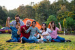 © StockImageFactory - Indian family smiling together while camping and enjoying relaxed outdoor moments