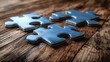 © HERMAWAN - 3 Puzzle Pieces on Wood Table Background.