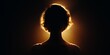 © RaptorWoman - A silhouette of a woman with glowing backlit hair, creating a dramatic and mysterious portrait against a dark background.