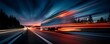 © Rifqi - Truck with motion blur on the highway during dusk, side view with abstract light trails. Concept for logistics management, fast delivery and distribution services