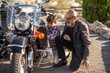 © Antonio Recena - Grandfather and grandson: The 60-year-old man shows his grandson the motorcycle and they adjust it.