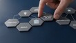 © hubaib - A hand places an 'ACTION PLAN' tile into a strategic business planning network, illustrating goal setting and implementation.