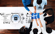 © InfiniteFlow - Professionals collaborate on an artificial intelligence project by assembling puzzle pieces. Data visualizations enhance teamwork and innovation in a modern office setting. Trope