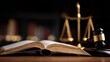 © Plaifah - Open law book with blurred library background, wooden gavel and golden scales on dark table, symbolizing justice and legal practice